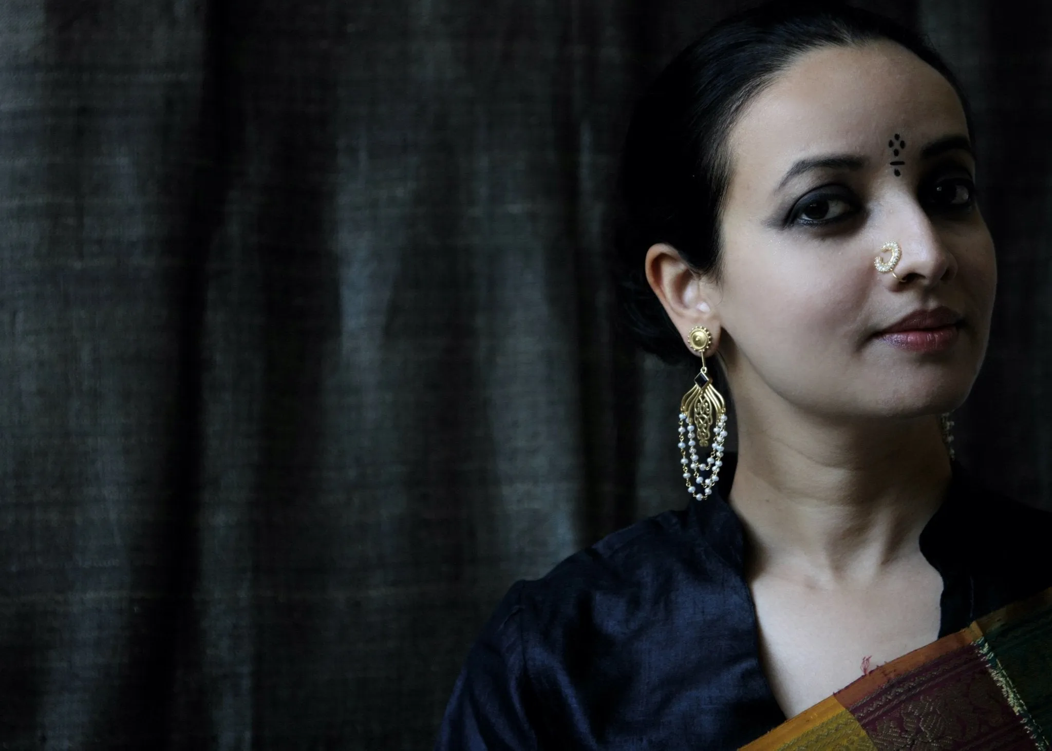 Regal, gold-plated, seed pearls studded, crescent nose pin