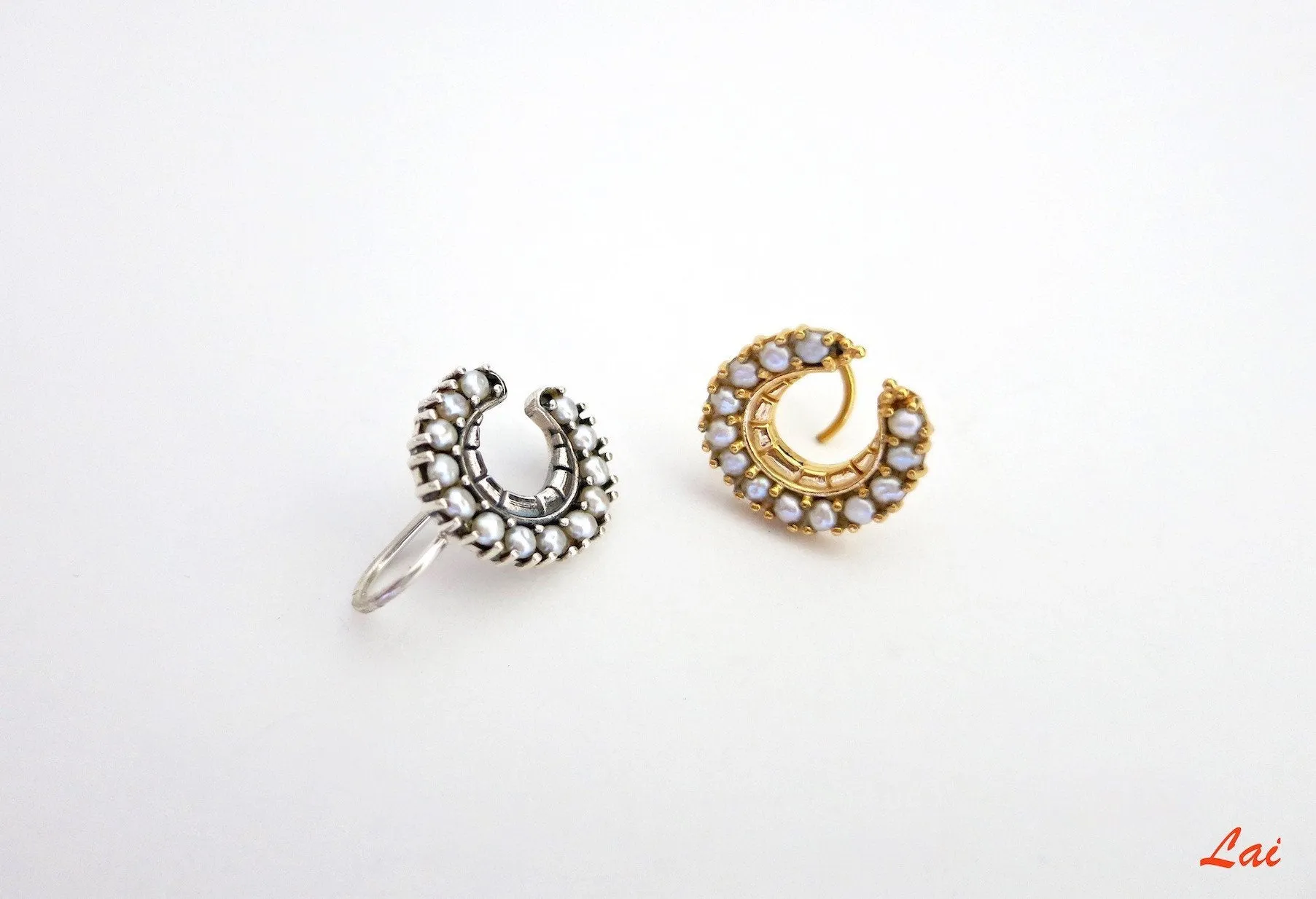 Regal, gold-plated, seed pearls studded, crescent nose pin