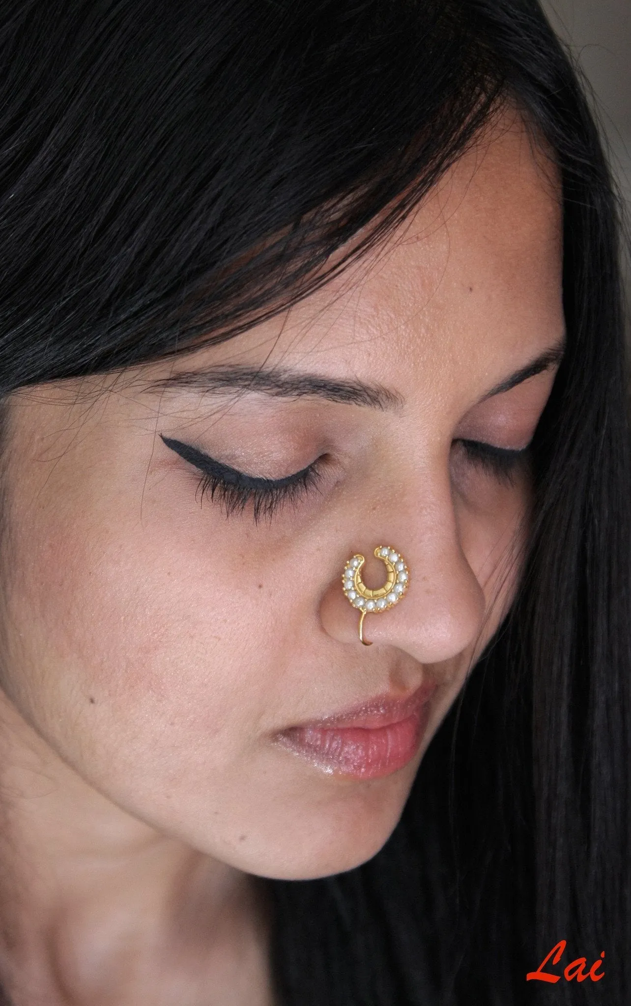 Regal, gold-plated, seed pearls studded, crescent nose pin
