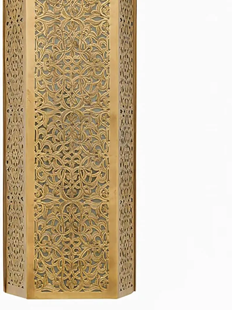 This stylish, shaded contemporary Moroccan wall light adds a touch of elegance and sophistication to any home decor.